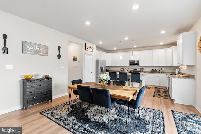 325 Hickory Ridge Cir, York, PA 17404 - dining area with light wood-style flooring, baseboards, and recessed lighting