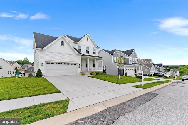 325 Hickory Ridge Cir, York, PA 17404 - view of front of property with board and batten siding, driveway, a porch, a residential view, and a front yard