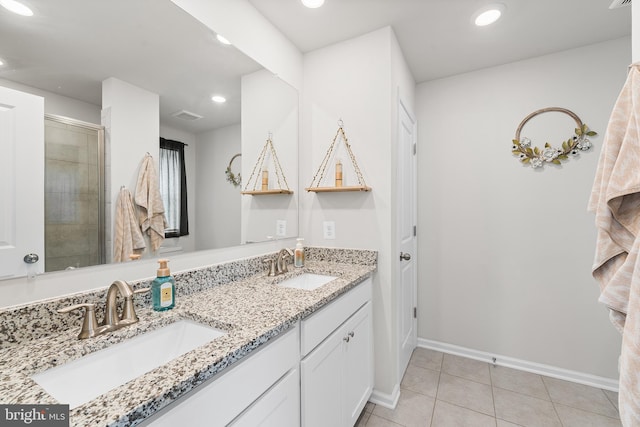 325 Hickory Ridge Cir, York, PA 17404 - bathroom featuring double vanity, baseboards, tile patterned flooring, recessed lighting, and a tile shower