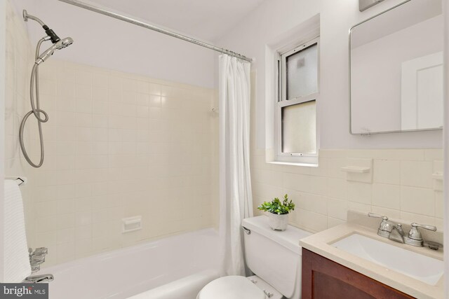 7307 15th Ave, Takoma Park, MD 20912 - full bath with shower / bath combo with shower curtain, vanity, and tile walls