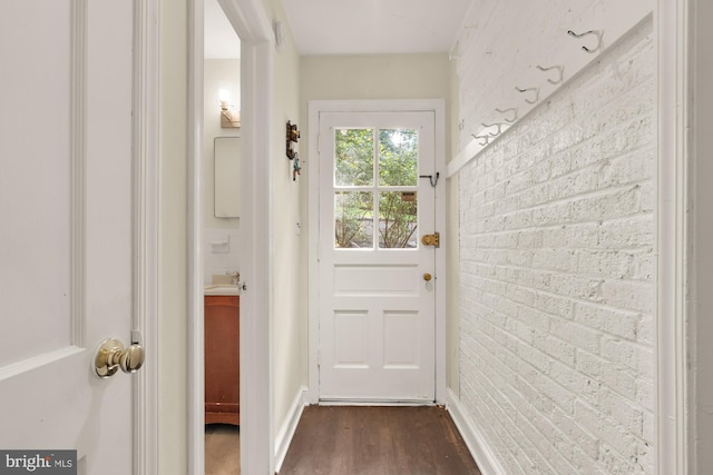 7307 15th Ave, Takoma Park, MD 20912 - doorway featuring dark wood-style flooring and brick wall