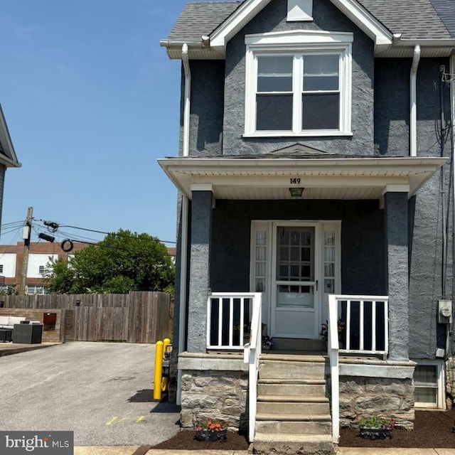 149 Roosevelt Ter, Ardmore, PA 19003 - view of front of house featuring a porch, stucco siding, and roof with shingles