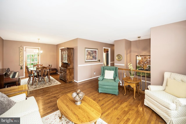 806 Edwards Dr, Fredericksburg, VA 22405 - living area featuring a chandelier, wood finished floors, and baseboards