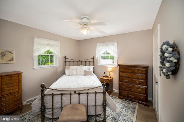 806 Edwards Dr, Fredericksburg, VA 22405 - carpeted bedroom with multiple windows, baseboards, and a ceiling fan