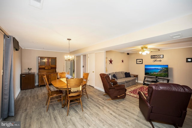 806 Edwards Dr, Fredericksburg, VA 22405 - dining room featuring light wood-style floors, a chandelier, ceiling fan, and baseboards