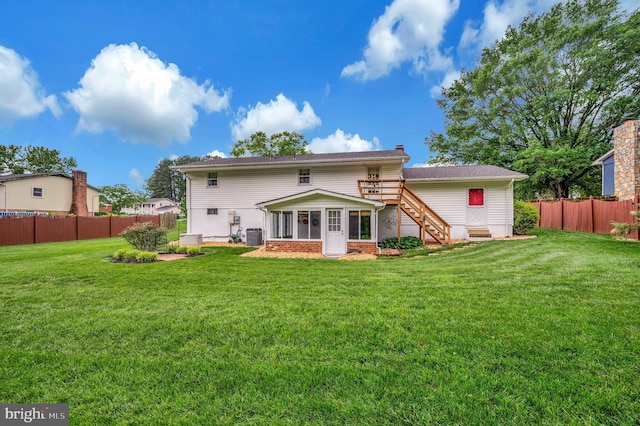 806 Edwards Dr, Fredericksburg, VA 22405 - back of house featuring stairs, a sunroom, a chimney, and cooling unit
