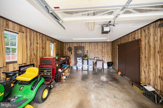 806 Edwards Dr, Fredericksburg, VA 22405 - garage featuring a garage door opener and wooden walls