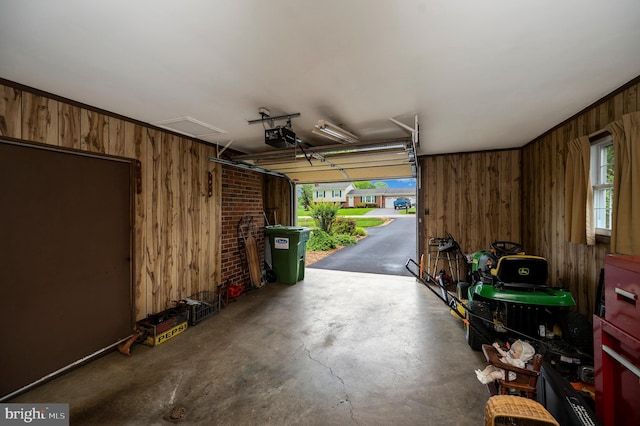 806 Edwards Dr, Fredericksburg, VA 22405 - garage featuring wooden walls and a garage door opener