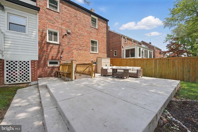 1615 Webster St NE, Washington, DC 20017 - rear view of property with an outdoor hangout area, a patio area, and brick siding