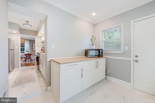 1615 Webster St NE, Washington, DC 20017 - kitchen with appliances with stainless steel finishes, light marble finish flooring, white cabinetry, recessed lighting, and ornamental molding