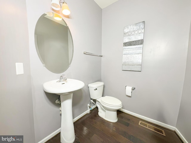 9506 Manor Oaks Vw, Upper Marlboro, MD 20772 - half bathroom with baseboards, wood finished floors, and toilet