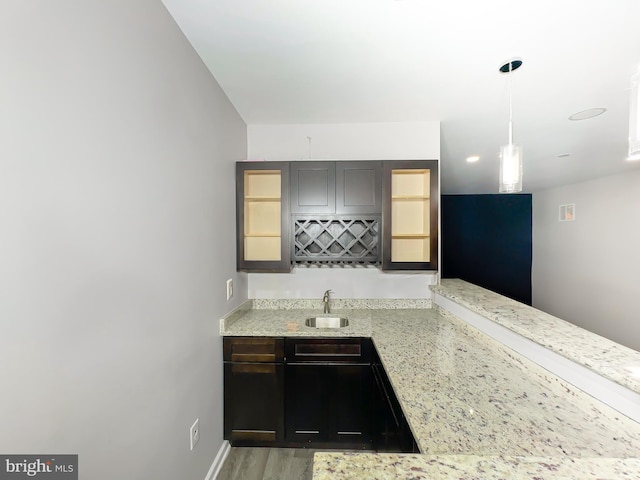9506 Manor Oaks Vw, Upper Marlboro, MD 20772 - indoor wet bar featuring decorative light fixtures and light wood-type flooring