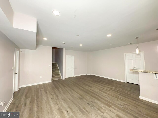 9506 Manor Oaks Vw, Upper Marlboro, MD 20772 - unfurnished living room with wood finished floors, recessed lighting, stairs, and baseboards