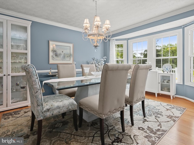 6601 Stipa Ct, Elkridge, MD 21075 - dining space with a chandelier, wood finished floors, ornamental molding, and a textured ceiling
