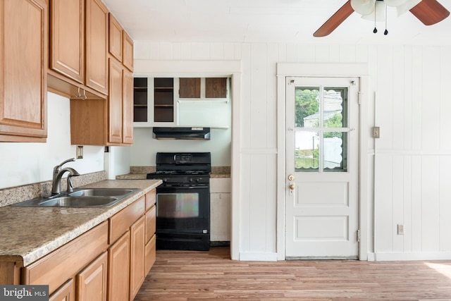 1926 W Broad St, Bethlehem, PA 18018 - kitchen featuring black gas stove, a sink, under cabinet range hood, light wood finished floors, and ceiling fan