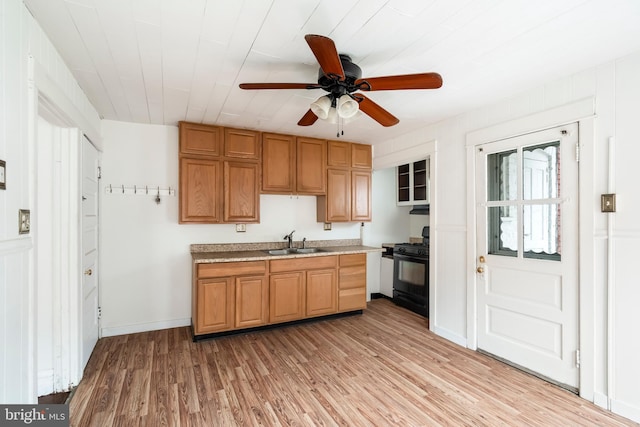 1926 W Broad St, Bethlehem, PA 18018 - kitchen with black gas range oven, a sink, ceiling fan, light wood-style flooring, and light countertops