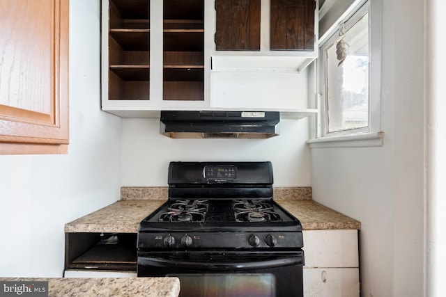 1926 W Broad St, Bethlehem, PA 18018 - kitchen with black range with gas cooktop, under cabinet range hood, and light countertops