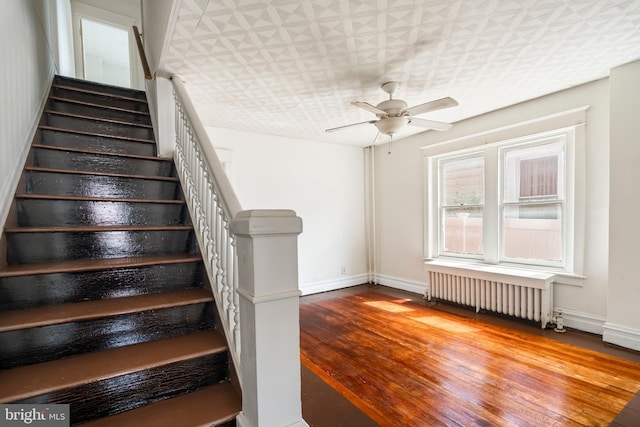 1926 W Broad St, Bethlehem, PA 18018 - stairs with radiator heating unit, baseboards, a ceiling fan, wood finished floors, and an ornate ceiling