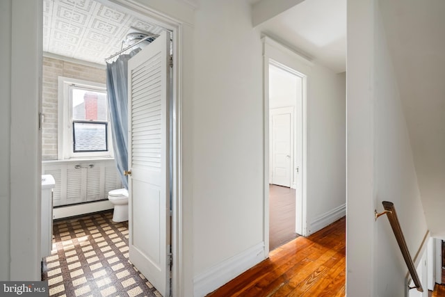 1926 W Broad St, Bethlehem, PA 18018 - corridor with an upstairs landing, a baseboard heating unit, tile patterned floors, and baseboards