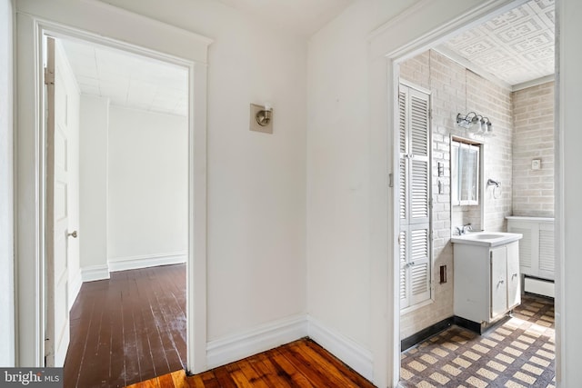 1926 W Broad St, Bethlehem, PA 18018 - hallway with a sink, baseboards, and wood-type flooring