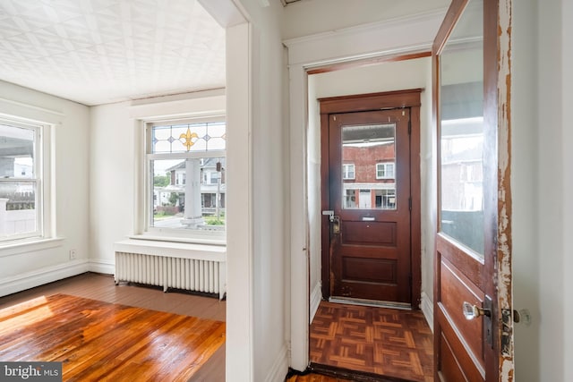 1926 W Broad St, Bethlehem, PA 18018 - entryway with radiator, baseboards, and parquet floors
