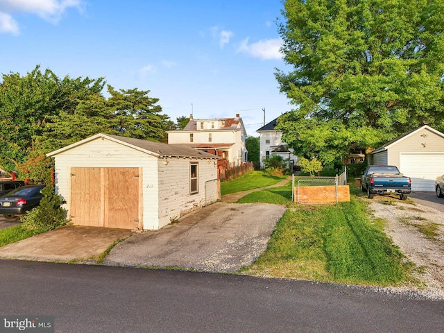 215 W Main St, Newmanstown, PA 17073 - view of front of property featuring an outbuilding, a detached garage, and driveway
