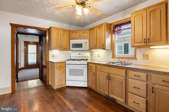 215 W Main St, Newmanstown, PA 17073 - kitchen featuring white appliances, a sink, dark wood-style flooring, and decorative backsplash