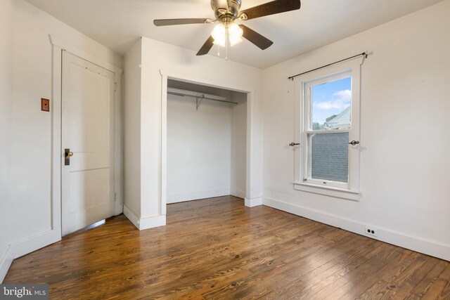 215 W Main St, Newmanstown, PA 17073 - unfurnished bedroom featuring wood-type flooring, baseboards, a closet, and ceiling fan