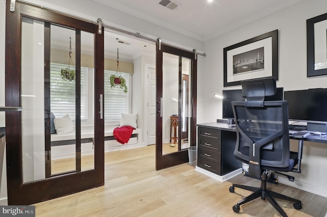 1367 Cedar Ave, Annapolis, MD 21403 - office area featuring ornamental molding, light wood-style flooring, and a barn door