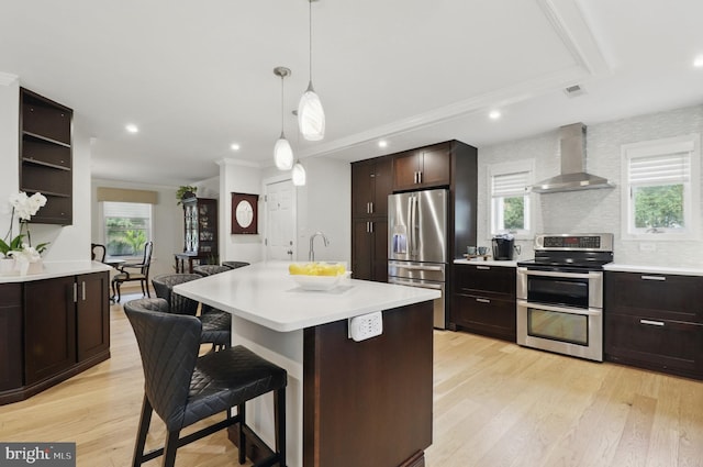 1367 Cedar Ave, Annapolis, MD 21403 - kitchen with wall chimney exhaust hood, appliances with stainless steel finishes, light countertops, crown molding, and recessed lighting
