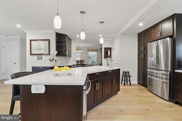 1367 Cedar Ave, Annapolis, MD 21403 - kitchen with stainless steel fridge with ice dispenser, ornamental molding, a sink, a breakfast bar area, and open shelves