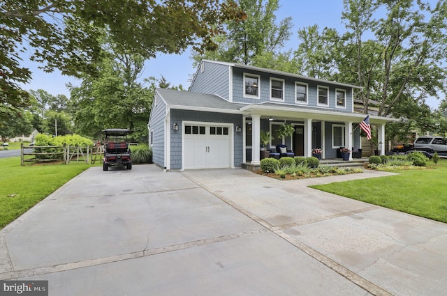 1367 Cedar Ave, Annapolis, MD 21403 - view of front facade featuring a porch, a garage, and driveway