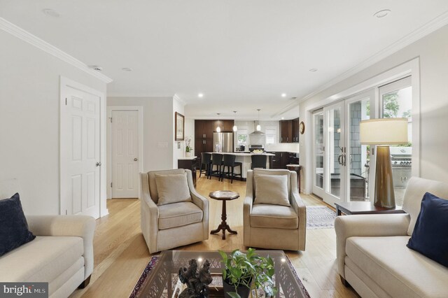 1367 Cedar Ave, Annapolis, MD 21403 - living area with light wood-style flooring, ornamental molding, french doors, and recessed lighting