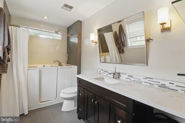 1367 Cedar Ave, Annapolis, MD 21403 - full bath with vanity, tile patterned flooring, toilet, backsplash, and recessed lighting