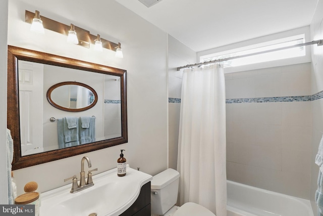 1367 Cedar Ave, Annapolis, MD 21403 - bathroom featuring toilet, shower / bath combination with curtain, and vanity