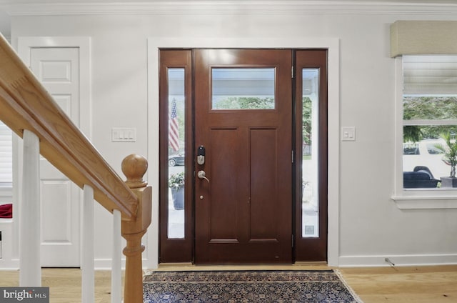 1367 Cedar Ave, Annapolis, MD 21403 - entrance foyer featuring wood finished floors, ornamental molding, baseboards, and stairway