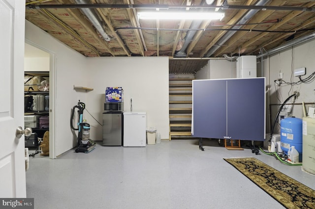 1367 Cedar Ave, Annapolis, MD 21403 - unfinished basement featuring fridge and a water pressure tank