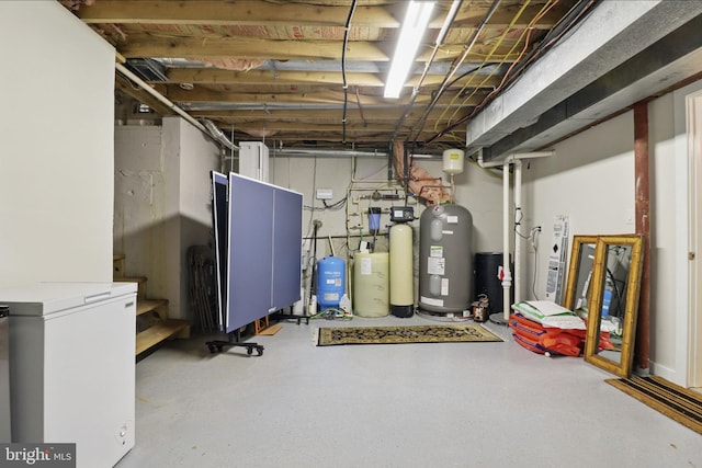 1367 Cedar Ave, Annapolis, MD 21403 - unfinished below grade area featuring a water softener, a water pressure tank, and stairs