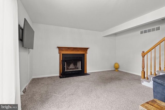 7 Pin Oak Dr, Dover, DE 19904 - unfurnished living room featuring carpet flooring, stairs, a fireplace with flush hearth, and baseboards