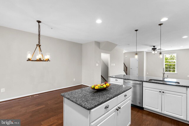 9778 Peace Springs Rdg, Laurel, MD 20723 - kitchen with stainless steel dishwasher, a kitchen island, dark wood finished floors, white cabinets, and recessed lighting