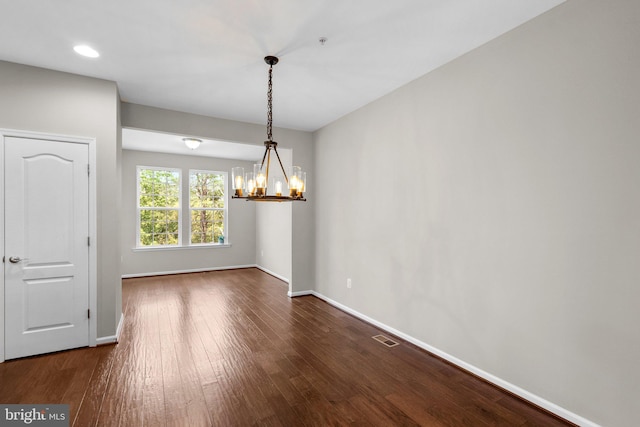 9778 Peace Springs Rdg, Laurel, MD 20723 - unfurnished dining area featuring a chandelier, dark wood finished floors, and recessed lighting