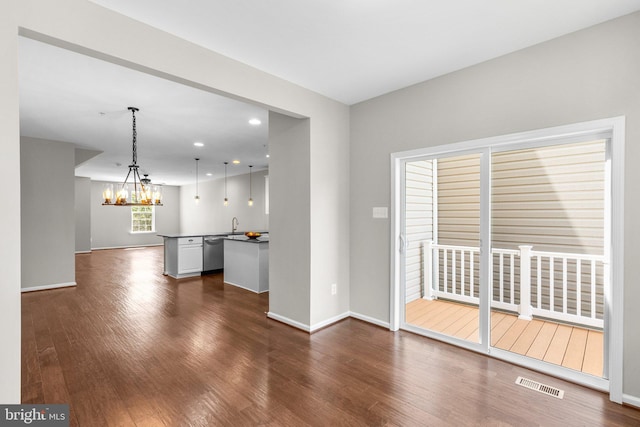 9778 Peace Springs Rdg, Laurel, MD 20723 - unfurnished living room featuring dark wood-style floors, a chandelier, and recessed lighting