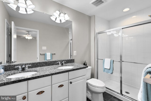 9778 Peace Springs Rdg, Laurel, MD 20723 - bathroom featuring double vanity, a shower stall, tile patterned flooring, and ceiling fan