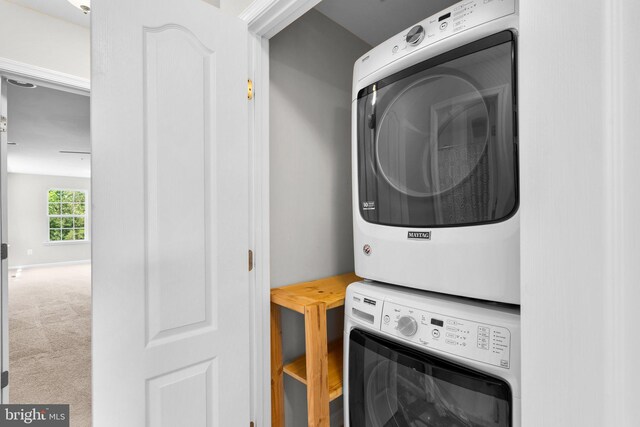 9778 Peace Springs Rdg, Laurel, MD 20723 - washroom featuring stacked washer / drying machine and carpet floors