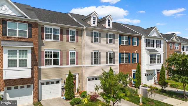 9778 Peace Springs Rdg, Laurel, MD 20723 - townhome / multi-family property with a garage, brick siding, driveway, and a residential view