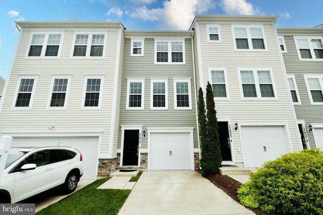 17023 Gibson Mill Rd, Dumfries, VA 22026 - view of property with an attached garage, driveway, and stone siding