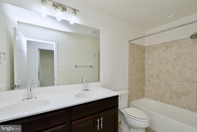 17023 Gibson Mill Rd, Dumfries, VA 22026 - bathroom with double vanity, toilet, and shower / washtub combination