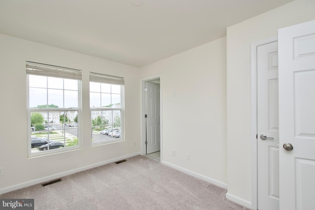 17023 Gibson Mill Rd, Dumfries, VA 22026 - spare room featuring baseboards and light colored carpet