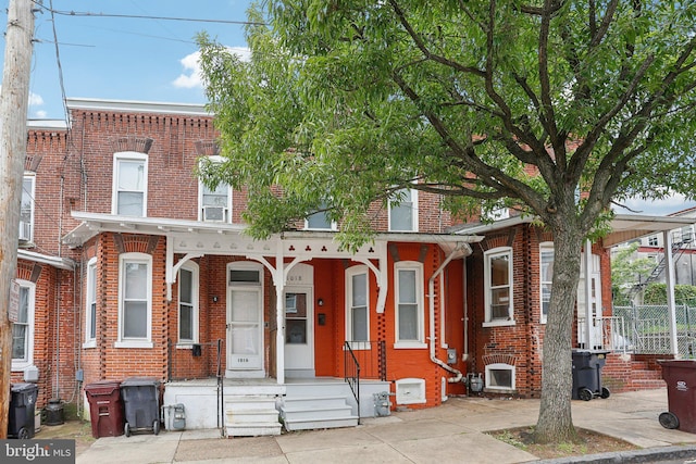 1018 W 7th St, Wilmington, DE 19805 - multi unit property featuring covered porch and brick siding