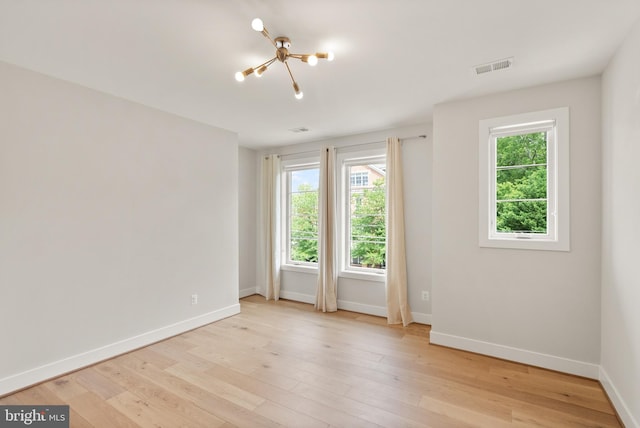 1554 Davidson Rd, Mclean, VA 22101 - empty room with baseboards, light wood-style flooring, and a chandelier